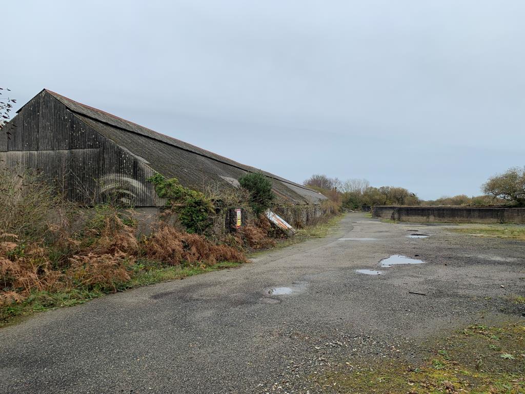 Lot: 4 - FREEHOLD SITE WITH STORE BUILDING AND CHIMNEY STACK - Substantial Building from Alternative View